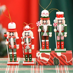 Set of four 13cm wooden Christmas nutcracker soldiers with candy details and gold hanging ropes