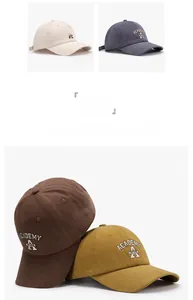 Detail of ACADEMY shield embroidery on four vintage washed cotton baseball caps