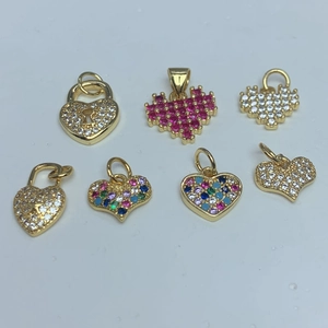 Detailed view of various gold heart pendants with colorful zircon and pixel art style