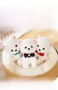 Three cute plush Pomeranian puppies in a basket wearing colorful plaid bow ties