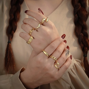 Minimalist 925 sterling silver gold rings set featuring chain and wave stacking designs
