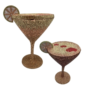 Detail of rose gold martini glass clutch bag with crystals and lemon slice decoration