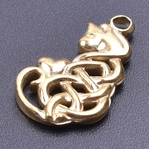 Macro shot of gold cat pendant with Celtic knot and heart design in stainless steel
