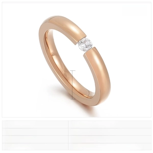 Detail of 3mm rose gold stainless steel ring with a single zircon inlay and polished finish