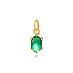 Macro shot of gold turtle pendant with emerald zircon for DIY jewelry crafts