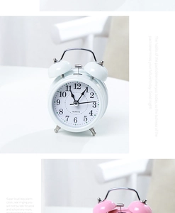 Detail view of 3-inch metal twin bell alarm clock featuring mechanical ringing and quartz movement