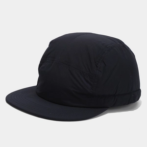 Detail of five-panel camper hat featuring premium black water-resistant synthetic fabric