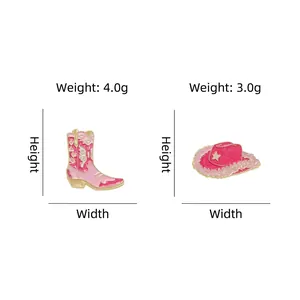 Pink glitter enamel pins featuring cowboy boot and hat designs with gold metal outlines