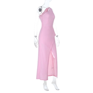 Detail of pink one-shoulder evening dress with ruffled neckline and high leg slit