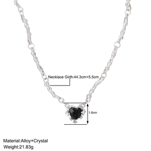 Detail shot of silver heart pendant necklace with dimensions and black crystal inlay