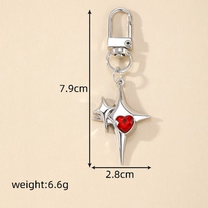 Silver star keychain with red heart gemstone and dimensions 7.9cm by 2.8cm