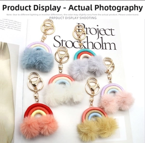 Detailed view of bohemian rainbow keychains with colorful plush pom poms in six assortments