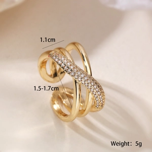 Crossed hollow gold-plated ring with zircons and geometric line design details