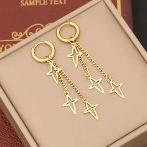 Long tassel star drop earrings in 18k gold finish featuring dangling hollow star pendants