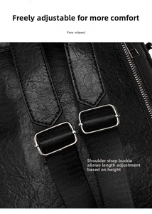 Close-up of adjustable woven shoulder strap and metal buckle on black leather backpack