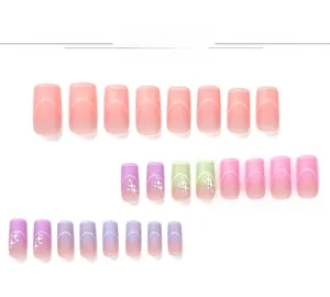 Detailed view of 24pcs pink and purple gradient press-on nails with glitter stars