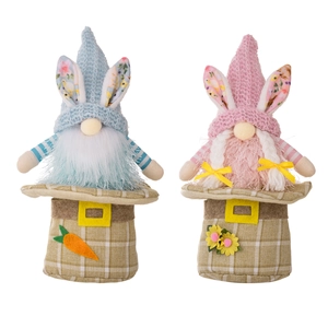 Easter gnome plush toys with bunny ears and floral knit hats on a white background