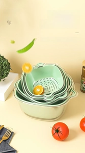 Macro shot of 8-piece double-layer drain baskets with green liners and clear basins