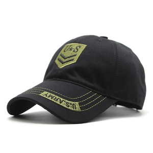 Detail of U.S. ARMY embroidery and military patches on black cotton camo baseball cap