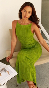 Detail of lime green pleated maxi dress showing wavy texture and backless slim fit design