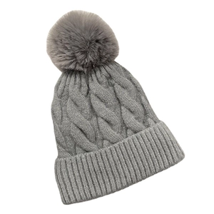 Winter grey cable knit beanie with fluffy pompom and warm fleece lining for women