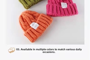 Close-up of cable knit beanie hats in green, red, and orange with decorative white woven labels
