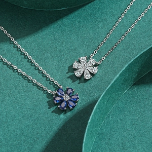 Elegant S925 silver necklace with blue and white zircon flower pendant on dark green background