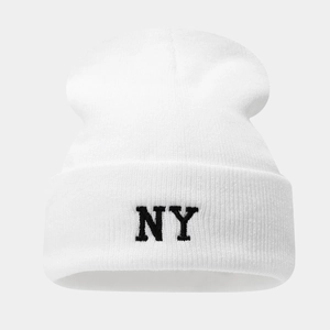 Close-up of fine knit texture and black NY letter embroidery on the white beanie