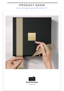 Detail of luxury black gift box with gold logo label and custom printed champagne ribbon