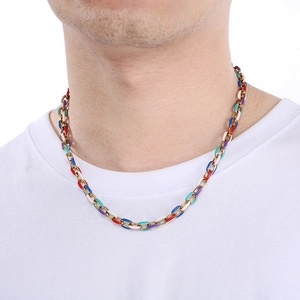 Detail of colorful enamel segments and gold chain links on the necklace pendant
