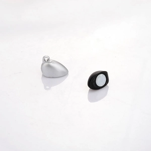 Close-up of heart-shaped magnetic clasp in silver and black for DIY jewelry crafts