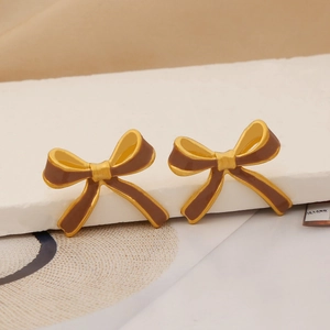 Elegant gold-plated stainless steel bow earrings with brown enamel finish for women