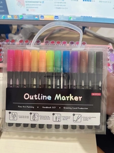 Detailed view of 36-piece outline marker set in a clear handle box for DIY art