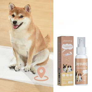 30ml pet potty training spray with dog on pee pad showing the packaging and usage