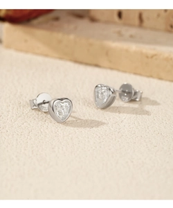 Close-up of heart-shaped S925 sterling silver earrings with moissanite inlays