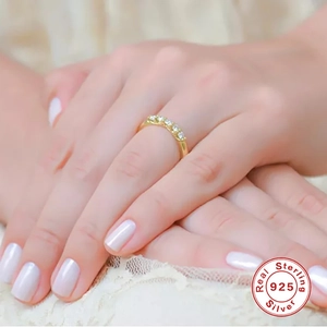 Elegant gold S925 sterling silver eternity ring with diamonds on lace background