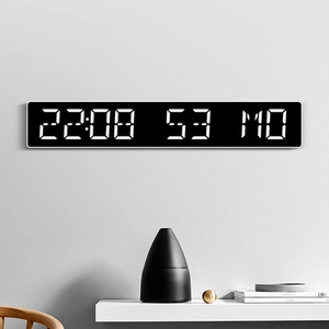Reloj de pared digital LED negro moderno que muestra la hora y el día en estante