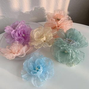 Pinces à cheveux à fleurs pastel en couleurs assorties comme le violet et le vert