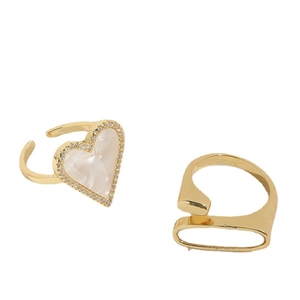 Luxurious gold heart rings set with shell inlay and zircon accents on white background
