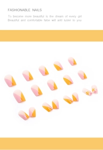 Detailed view of square orange and pink patchwork press-on nails with floral patterns