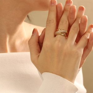 Close-up of 18K gold plated multi-layer crisscross ring with micro-pave cubic zirconia