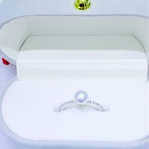 Elegant silver ring with 6-7mm round pearl and pavé diamonds in a plush jewelry box