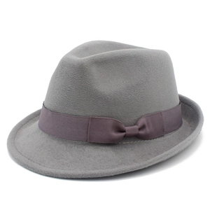 Detailed side view of grey wool felt fedora hat with matching decorative ribbon trim