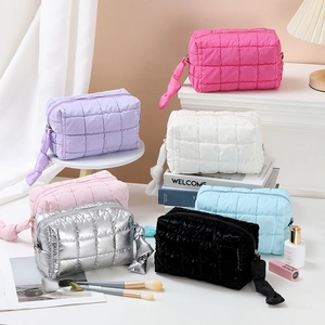 Portable quilted makeup bags in various vibrant colors for travel and toiletries storage