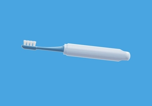 Detail view of the soft bristles and ergonomic blue and white handle of the pet toothbrush