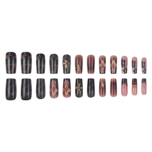 Retro brown press-on nails with leopard print, floral patterns, and cherry metal charms