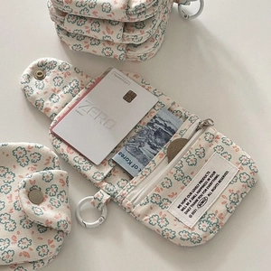 Floral canvas coin purse with daisy pattern, showing multiple compartments and interior card slots