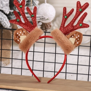 Detail view of red sequined reindeer antler headband with festive green bead accents