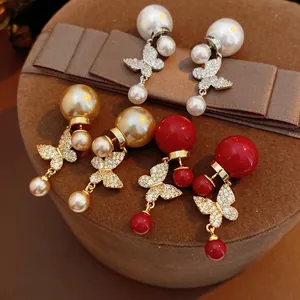 Vintage style butterfly pearl earrings with gold plating and zircons in three color options