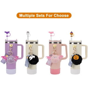 Multiple Halloween themed tumbler sets with ghost pumpkin straw toppers and pompom charms